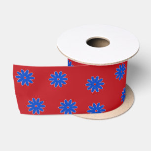 Blaue Blume in Rot Satinband