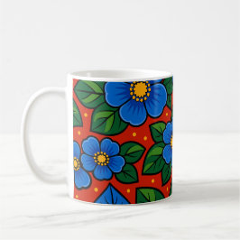 Blaue Blumen und grüne Blätter auf rotem Hintergru Kaffeetasse