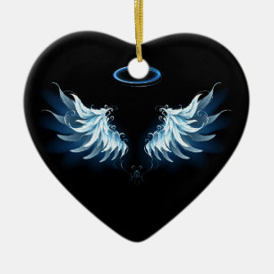 Blaue leuchtende Engelsflügel auf schwarzem Hinter Keramik Ornament