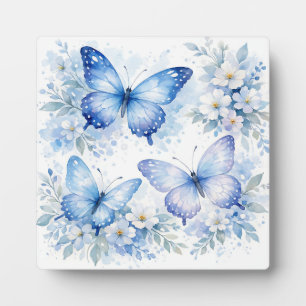 Blaue Schmetterlingsblumenanordnung Fotoplatte