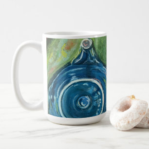 Blaue Teekanne und Chai-Kunstwerk Kaffeetasse