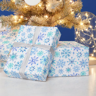 Blaue Wasserfarbe Winterschneeflocken und Glitzern Geschenkpapier