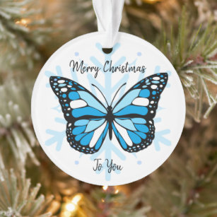 Blauer Schmetterling auf einem Schneeflocken Weihn Ornament