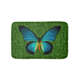 Blauer Schmetterling auf grünem Glitzer Badematte