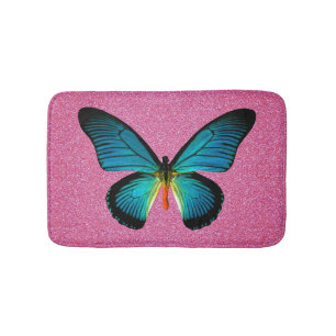Blauer Schmetterling auf rosa Glitzer Badematte