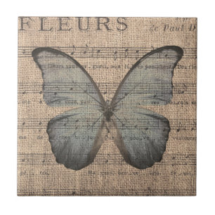 Blauer Schmetterling auf Vintager Blatt-Musik Fliese
