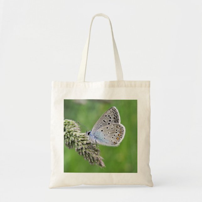 Blauer Schmetterling im Gras Tragetasche (Vorne)