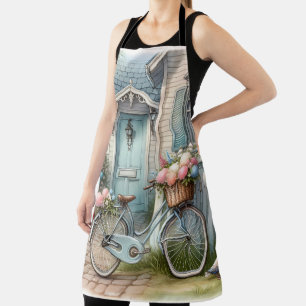 Blaues Cottage-Fahrrad mit Frühlingsblumenkorb Schürze