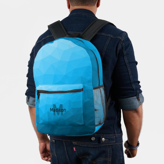 Blaues cyan geometrisches Maschenmuster Monogram Bedruckter Rucksack (Insitu (Modell))
