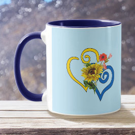 Blaues Gelbes geflecktes Herz mit Sonnenblume auf Tasse