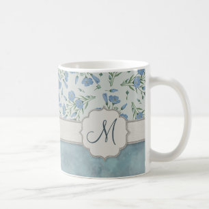Blaues Vergissmeinnicht mit Blumen und Marmor mit Tasse