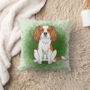 Blenheim Cavalier King Charles Spaniel auf Green Kissen