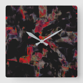 Blinkende rote Flecken auf dunkelgrauem Felsunterg Quadratische Wanduhr