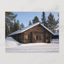 Blockhütte mit Schnee in Lappland Postkarte