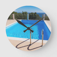 Blue Swimming pool with steps at sea