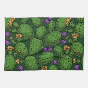 Blühende Opuntia auf dunkelgrün Geschirrtuch