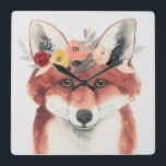 Blume Crown Forester Fox Quadratische Wanduhr<br><div class="desc">Dieses Aquarellbild zeichnet sich durch ein sanftes Portrait eines Fuchses aus,  der mit einer Blume geschmückt ist | Nach Grace Popp</div>