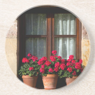 Blumenkübel am Fenster im Dorf Sandstein Untersetzer