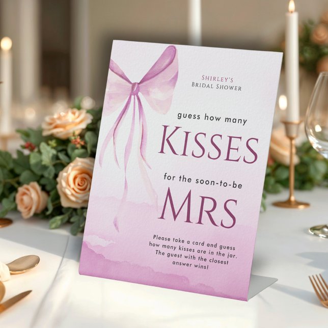 Blush Pink Bow Brautparty Raten wie viele Küsse Sockelschild (Von Creator hochgeladen)