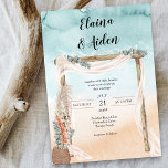 Boho Beach Arbor Watercolor Ocean Wedding Einladung<br><div class="desc">Boho Beach Hochzeit Einladung mit rustikalem Laub an einem sandigem Ozean Küste. Dieses wunderschöne Aquarell-Design hat einen Sandstrand, einen schicken Boheme-Hochzeitsbogen mit Vile und Eukalyptus mit einem Korb aus Pampasgras und tropischen Blume. Die Braut- und Bräutigamen werden in handgeschriebener Typografie geschrieben und die Vorlage steht Ihnen zur Verfügung, die übrigen...</div>