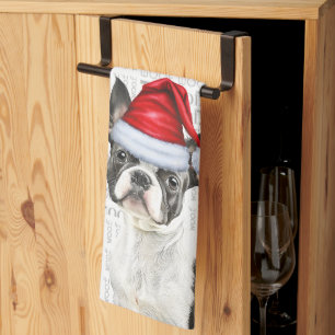 Boston Terrier Dog in einer Weihnachtsmannmütze Wo Geschirrtuch