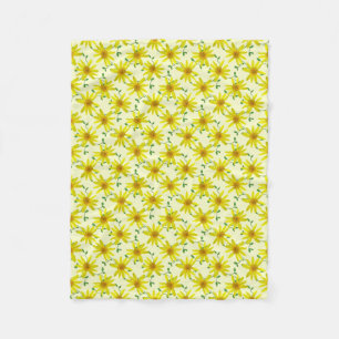Botanische gelbe Arnika-Wildblume auf irgendeiner Fleecedecke