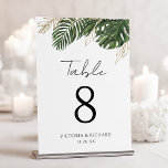 Botanischer Sommer-Boho-Hochzeit im tropischen Grü<br><div class="desc">Lassen Sie Ihre Gäste mit tropischer Eleganz in diesem fantasievollen Design der Tischnummer verwöhnen. Lebhafte grüne Blätter und schimmernde goldene Konturen krönen elegant einen knalligen, weißen Hintergrund und schaffen einen eleganten und natürlichen Mittelpunkt für Ihre Tische. Diese exquisite botanische Kunst fügt eine Touch von modernem Luxus hinzu, die das Ambiente...</div>