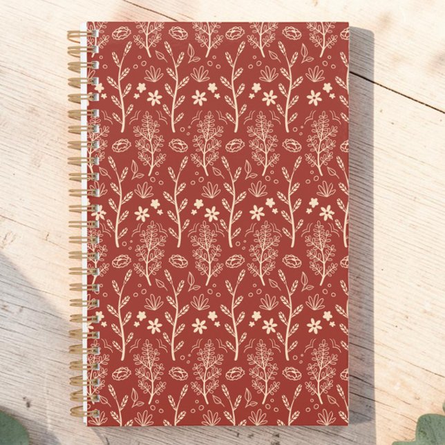 Botanisches Muster Planer (A planner covered in botanical sprigs in boho style in cream line art on deep terracotta rust red.)