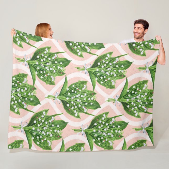 Bouquet der Lilie des Tals Blume auf rosa Fleecedecke (Beispiel)