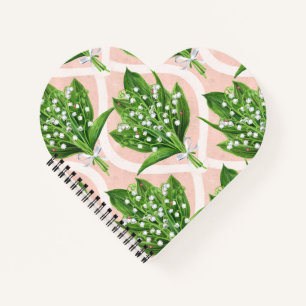 Bouquet der Lilie des Tals Blume auf rosa Notizbuch