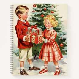 Boy and girl giving each other Christmas presents Notizbuch