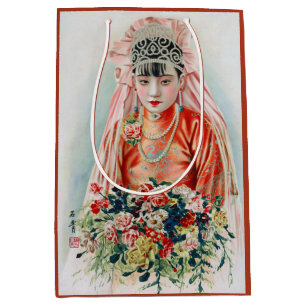 Braut in Rot auf einer chinesischen Hochzeit in Sh Mittlere Geschenktüte