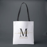 Bridesmaid Gift Gold Black Monogram White<br><div class="desc">Diese Bridesmaid Tote-Tasche enthält ein handgeschriebenes Monogramm aus Gold und schwarzem Schrift mit Swashes auf weißem Hintergrund. Präsentieren Sie Ihre Brautjungfrauen mit einer Tasche für die Beförderung von Gegenständen am Tag der Hochzeit,  und traditionell am Probe-Dinner oder vorher präsentiert.</div>