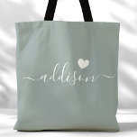 Bridesmaid Modern Script Heft Sage Green<br><div class="desc">Diese schicke Tote-Tasche ist mit einem wunderschönen Sage Green Hintergrund, einem modernen Script-Schriftart und einem zarten Herzdesign geschmückt. Die weiche, elegante Farbe und die ausgeklügelte Typografie machen sie zu einem idealen Accessoire für Brautmädchen oder alle, die stilvolle und trendige Designs Liebe haben. Dieser Totbeutel ist ideal für den Transport von...</div>