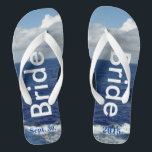 Bridge Ocean Waves Blue Sky Flip Flops<br><div class="desc">Einmalige Bride Flip Flops speziell entworfen. Hübscher blauer Himmel mit flauschigen weißen Wolken, blauem Meer und weißen Schaumwellen. Unisex Flip Flops mit Bride geschrieben in einem leicht silbernen Text, und Datum der Ehe in blauem Text. PERSONALISIEREN Sie mit Ihrem Hochzeitstag (oder löschen Sie Text). Ausgestellt mit breiten weißen Straps und...</div>