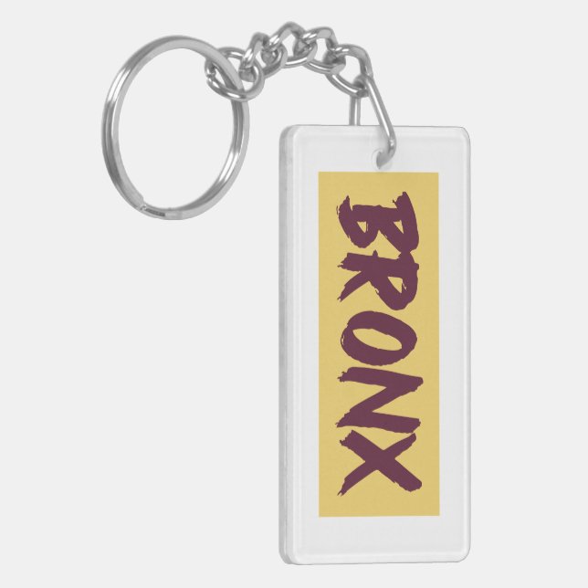 Bronx Text Base Design auf gelbem Hintergrund Schlüsselanhänger (Vorderseite links)