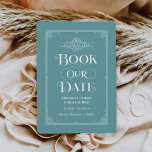 Buchen Sie unser Datum Mute Aqua Vintag Cover Hoch Save The Date<br><div class="desc">Diese einzigartige Hochzeit speichern die Datumskarten für Buchliebhaber mit einem Vintagen Buchcover-Design mit einer Schriftrolle,  die den Hochzeitstag umrahmen,  einem verzierten "Book Our Date"-Titel,  den Bride & Groom-Namen als Urheber,  einem gedämpften aqua-blauen Hintergrund / Buchfarbe (die modifiziert werden kann),  komplett mit einem Verlobung-Foto des Paares auf der Rückseite.</div>