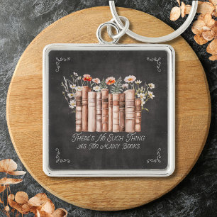 Bücher mit Blumen und Zitat auf schwarzer Tafel Schlüsselanhänger