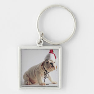 Bulldoggen-Welpen-tragende Weihnachtsmannmütze Schlüsselanhänger