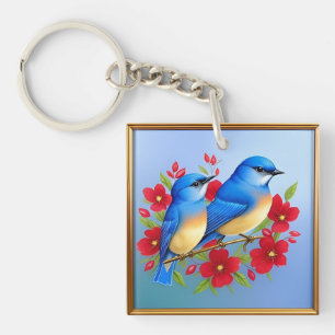Bunte Blaue Vögel sitzen zwischen roten Blumen Schlüsselanhänger