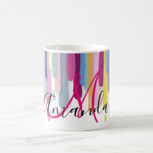Bunte Farbe, die abstraktes Monogramm tropft Kaffeetasse