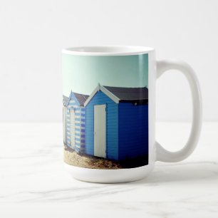 Bunte Strand-Hütten in The Sun Tasse