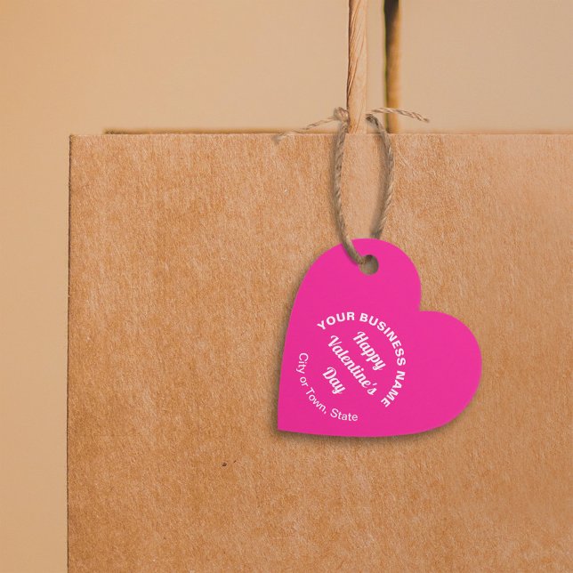 Business Valentine Gruß auf rosa Herzform Geschenkanhänger (Business Valentine heart shape pink tag hung on shopping bag.)