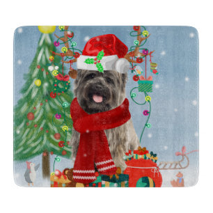 Cairn Terrier Dog in Snow mit Weihnachtsgeschenken Schneidebrett