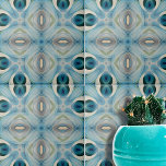 Calming Soft Blue und Indigo Geometric Muster Fliese<br><div class="desc">Diese Keramik Kachel zeigt ein komplexes kaleidoskopisches Muster. Das Design ist symmetrisch und weist abstrakte Formen auf, die an Blume und geometrische Figuren erinnern. Die Fliesen sind mit einer beruhigenden Palette von Blautönen, aquamarinen, cremefarbenen und weißen Farbtönen geschmückt, die harmonisch miteinander harmonieren und einen optisch ansprechenden Effekt erzeugen. Der zentrale...</div>