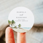 CANCUN Watercolor Beach Palm Tree Zielort Runder Aufkleber<br><div class="desc">Die Cancun Collection besticht durch ein Aquarellbild mit Sandstränden und tropischen Palmen,  die sich durch eine moderne und schlichte Kombination aus Schriftart auszeichnen. Bearbeiten Sie die Namen für Ihre Hochzeit,  um eine besondere Touch hinzuzufügen.</div>