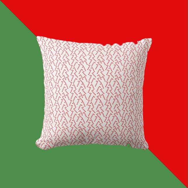 Candy Cane Muster rot und weiß Kissen (A throw pillow with a red and white candy cane Christmas pattern)