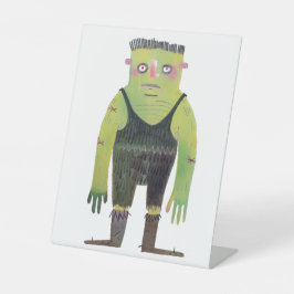 Cartoon-Monster mit grüner Haut Sockelschild
