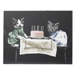 Cats celebrating a birthday with cake and candles notizblock