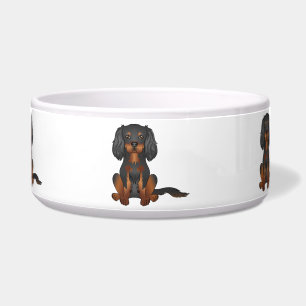 Cavalier King Charles Spaniel in Schwarz und Tan s Napf